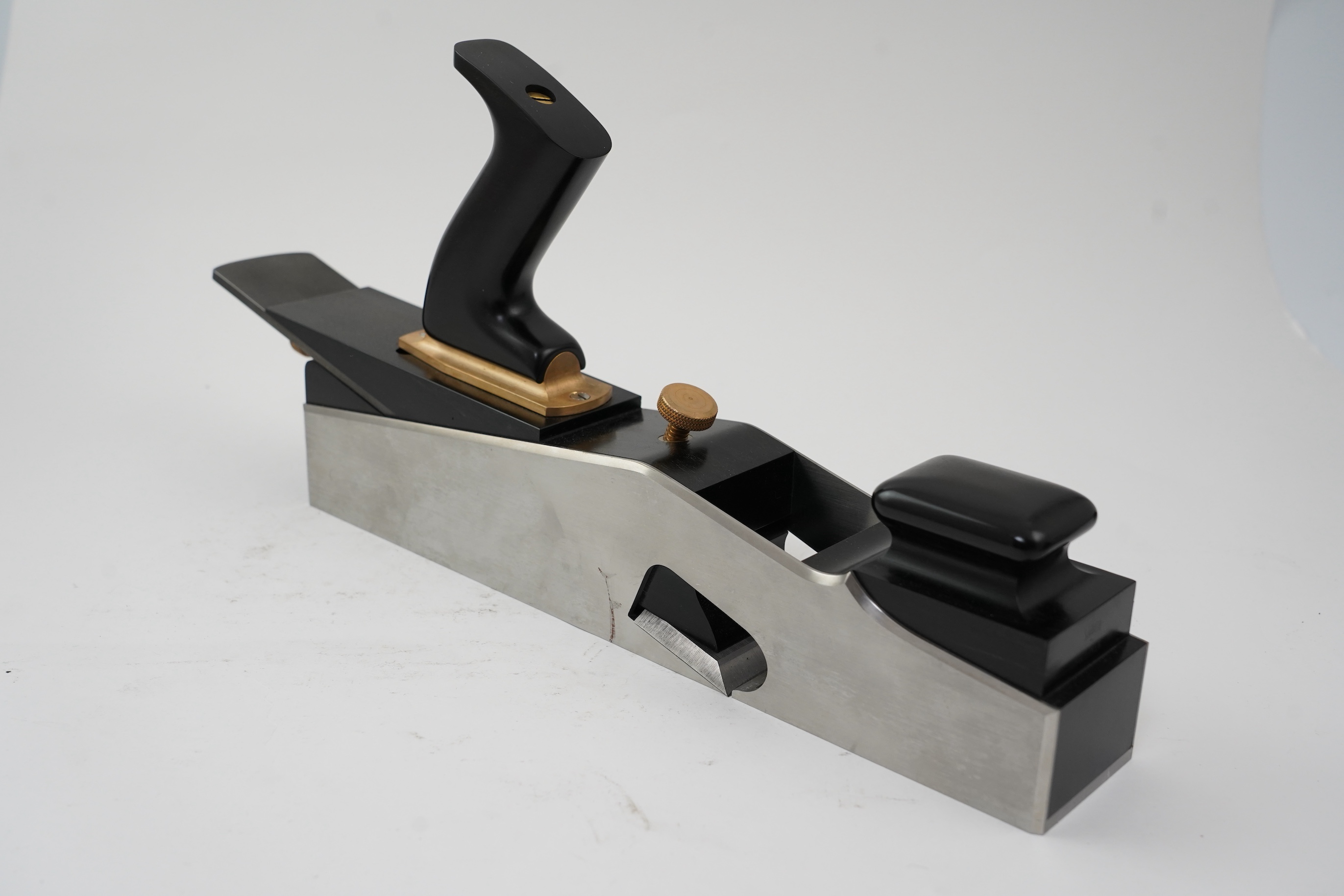 A very fine modern rebate mitre plane by Sauer & Steiner Toolworks, Ontario, handmade in the style of a Norris rebate mitre plane, with ebony infill, handle and wedge, adjustable iron, the handle on an adjustable lateral